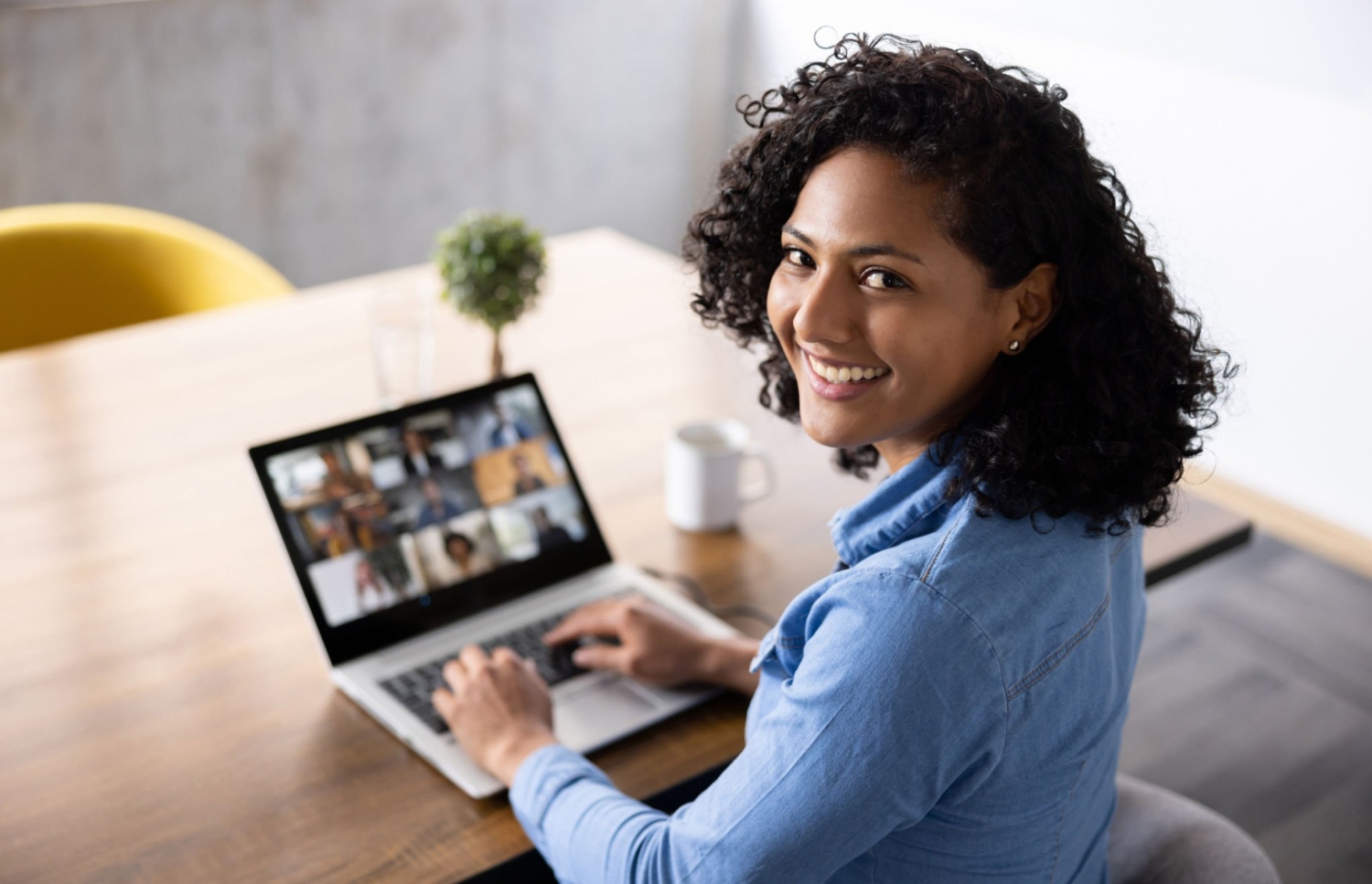 Happy woman on a business meeting via video call